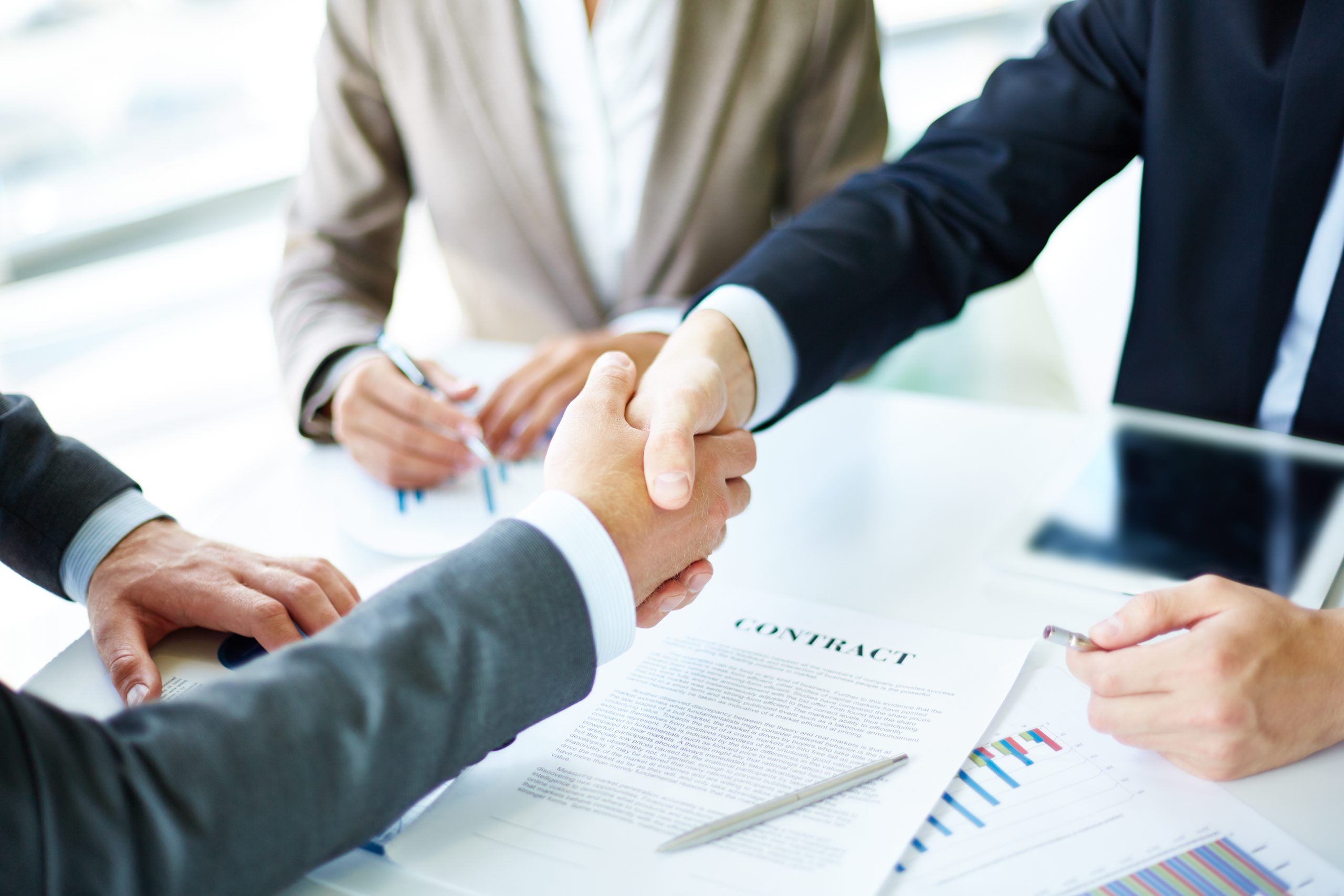 understanding-investor-vs-dealer-real-estate-success-path-handshake-close-up-executives-scaled understanding-investor-vs-dealer-real-estate-success-path-handshake-close-up-executives-scaled