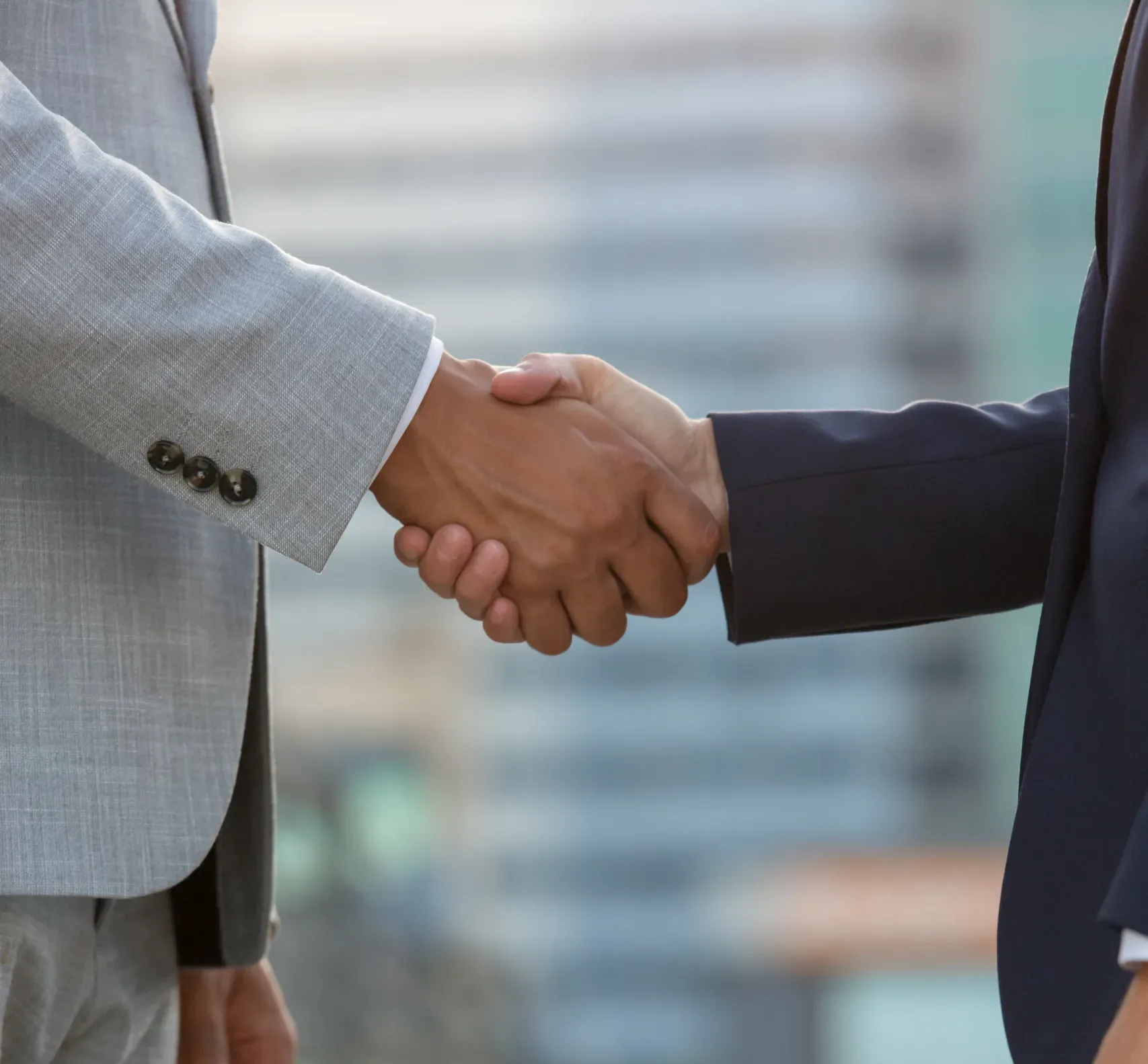 business-people-standing-city-street-shaking-hands business-people-standing-city-street-shaking-hands